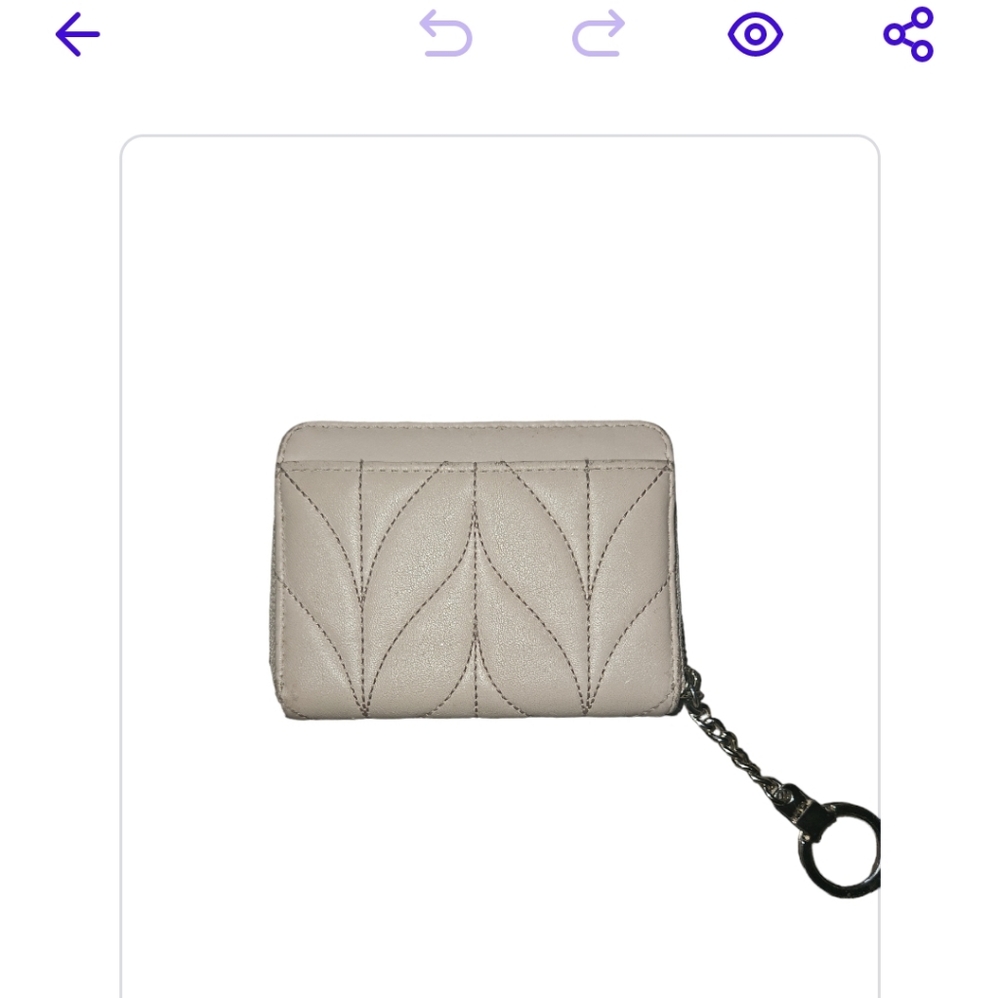 Kate spade small wallet with key chain attachment. Cream color NWOT